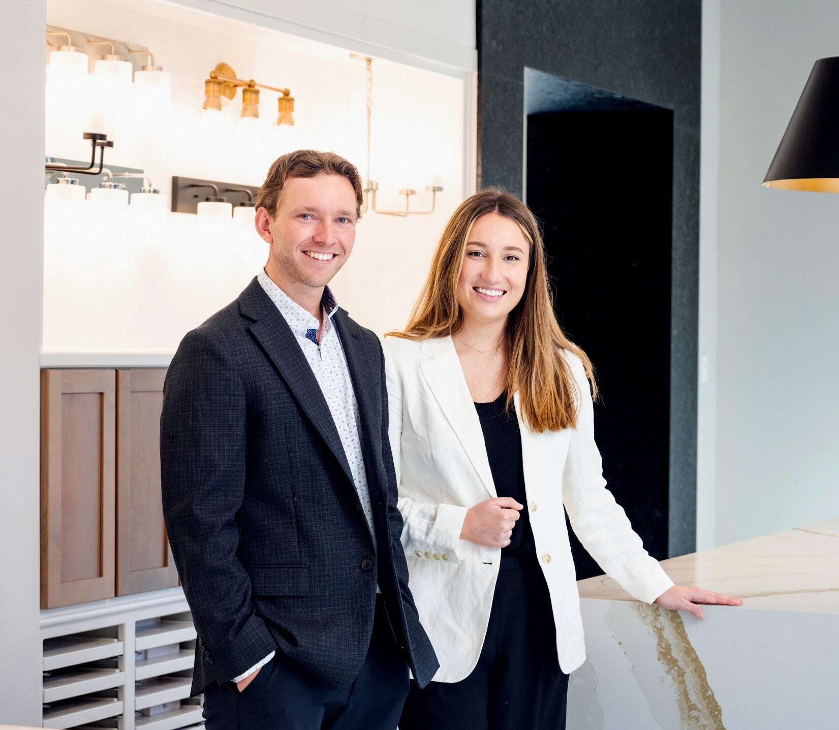 picture of a man and woman standing in a new home design studio